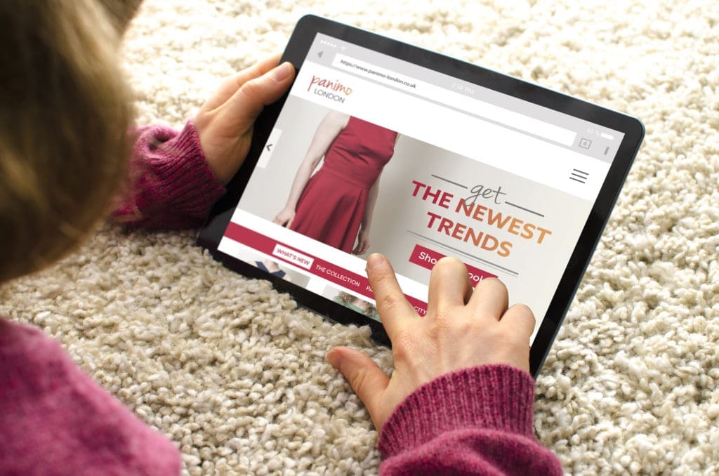 A woman is online buying clothes