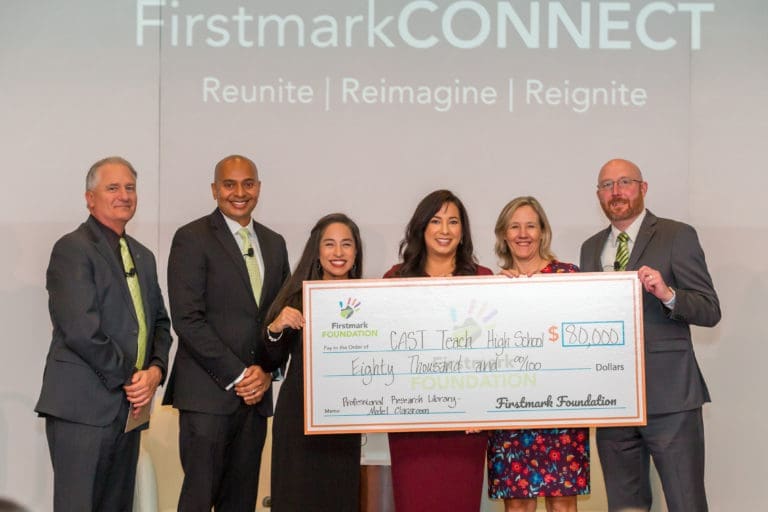 Donation check presentation to CAST Teach