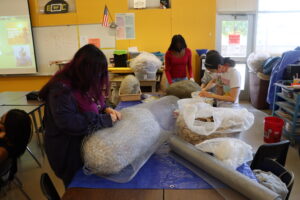 Students working on a sculpture