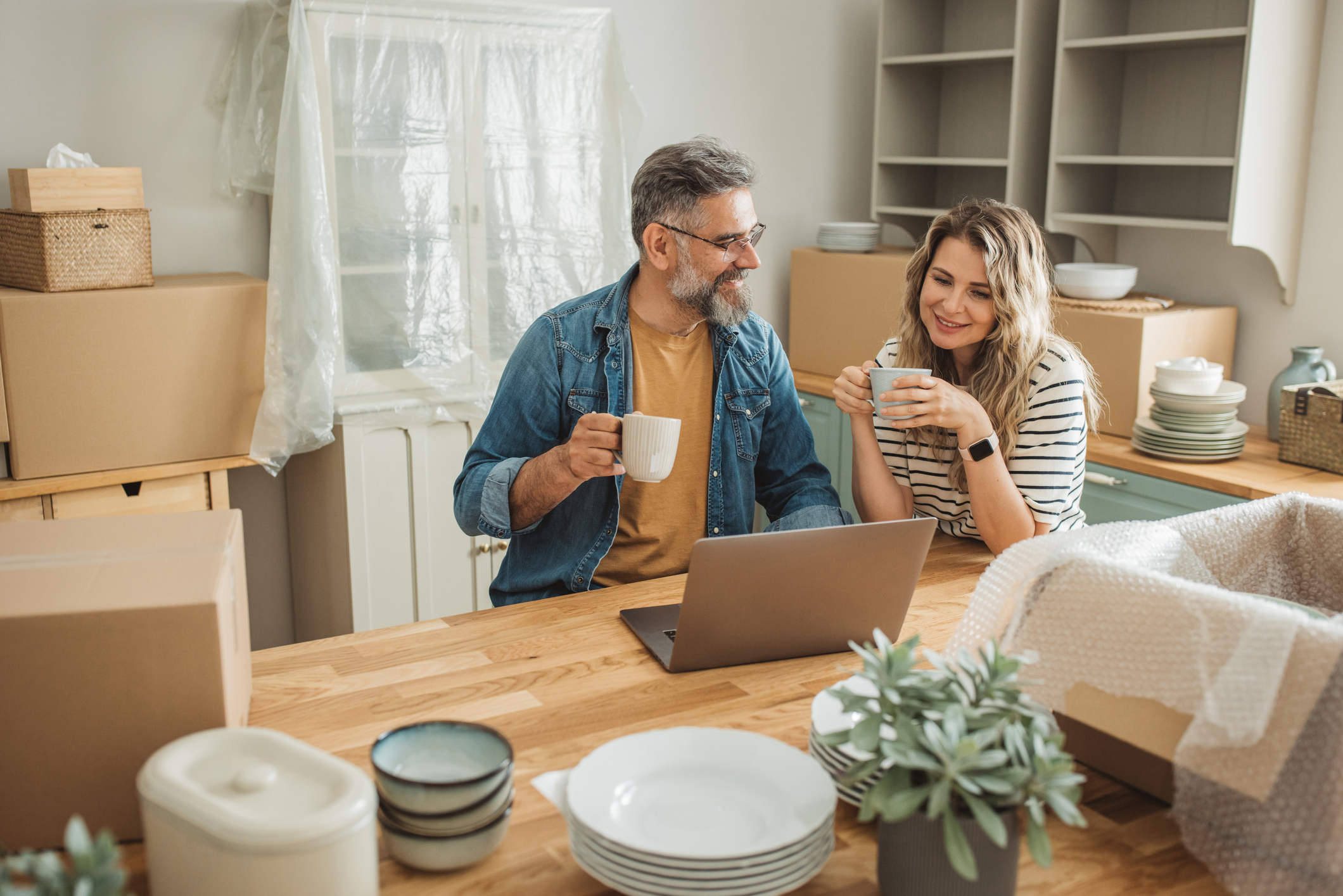 Mature Couple with Moving Boxes in New Home