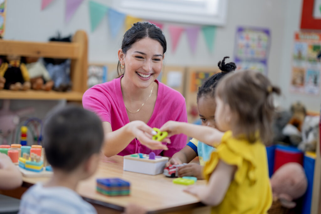 Preschool Teacher Engaging With Children in a Classroom Educational Setting